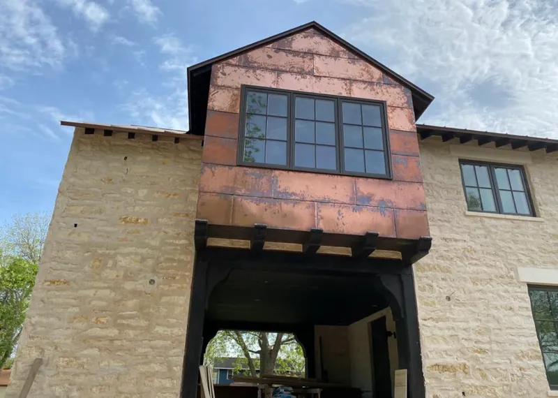 Copper metal panel facade on a stone building for Skylight Installation in Pompano Beach